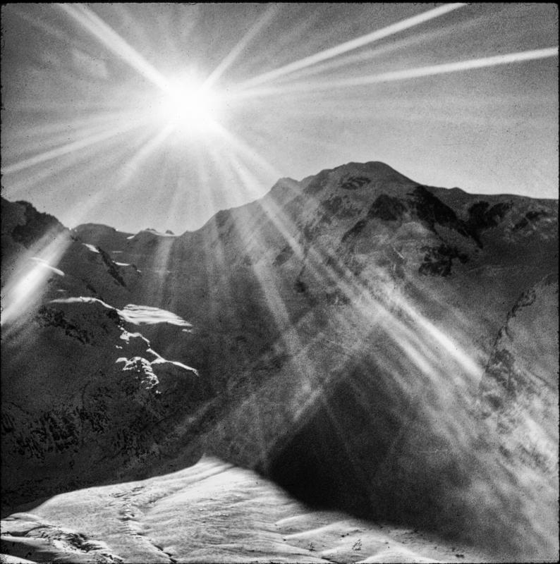 This is one of my first photographs and is the photograph that sparked  my interest in photography as a medium of communication.  My brother and his wife were living in Laufen, Switzerland, and since my father was an airline pilot we could fly to Europe relatively inexpensively, so we did in the winter of 1968, shortly after I turned 13.  I did not yet have my own camera but I remember that I was anxious to use my father's Kodak Instamatic.  While on a train I noticed this scene.  I remember feeling a spirituality while seeing the winter sun's rays over a mountain range in Switzerland and trying to capture that transcendental feeling with my father's camera.  I still experience that feeling when I look at this picture.  Not the actual feeling, perhaps, but a memory of the feeling.  That is the great power of photography - to capture a feeling - the passion, pursuit and perfection of which becomes an elusive and unobtainable goal.  Similar to the Heisenberg uncertainty principle.