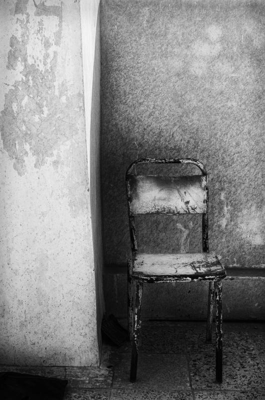 Time taken out during combat to make a simple photograph of a chair, an attempt to find beauty amid destruction.