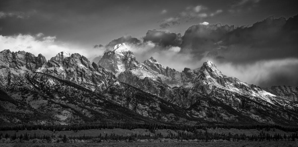 Speaking of iconic, majestic scenes... Buff and I took care of her mother when she was dying.  It was autumn and I needed to get away for a couple of days.  I decided to go to the Tetons but my trip was hampered somewhat by a huge thunderstorm with hail.  I made it to eastern Idaho at dusk and the clouds parted long enough for me to photograph the western side of the Tetons.  Throughout the night the sky cleared and the next morning, very early, I drove around to the eastern side.  While literally hundreds of photographers stood at Schwabacher's Landing, I stood alone a few miles away and made this photograph I call First Light.  I am absolutely certain that my mother had her hand in the making of this photograph, because she follows me everywhere and smooths my path in life.