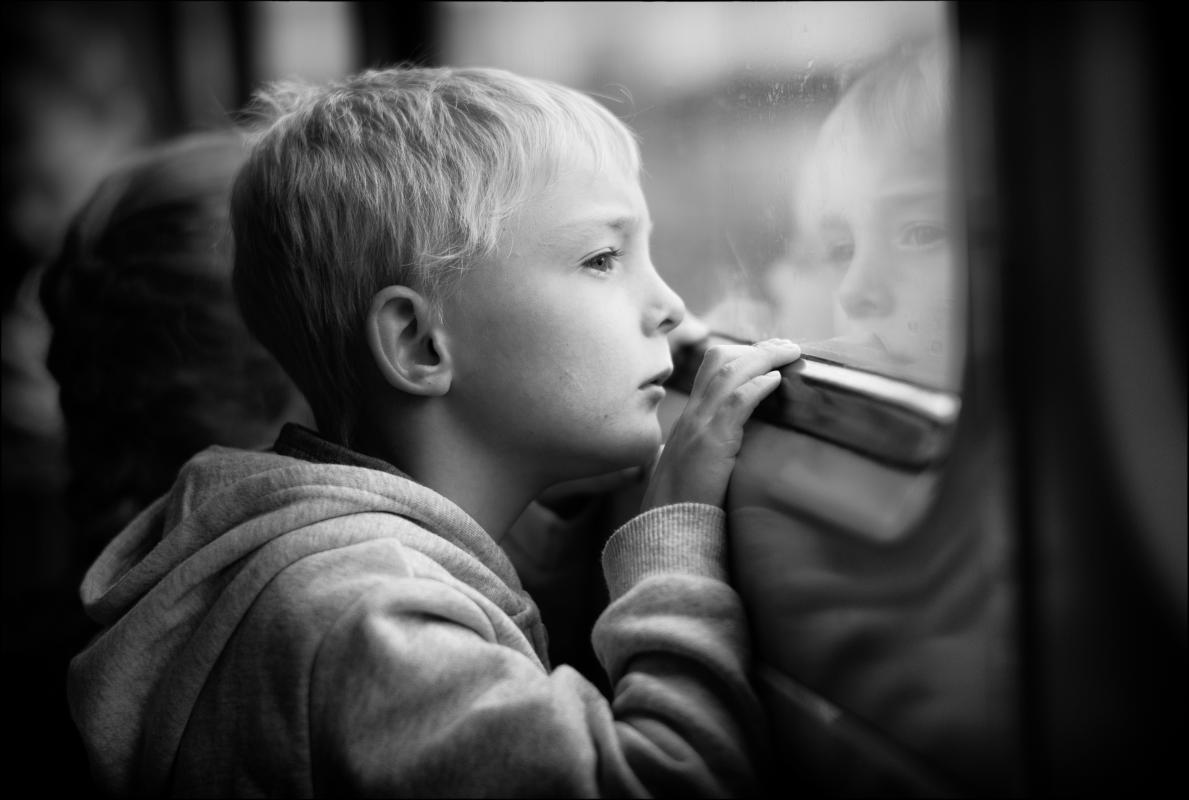 Candid portrait of a boy on a train in Yorkshire.